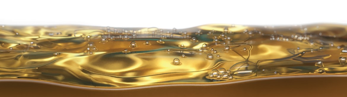 close view of bubbles on the surface of a pool of oil