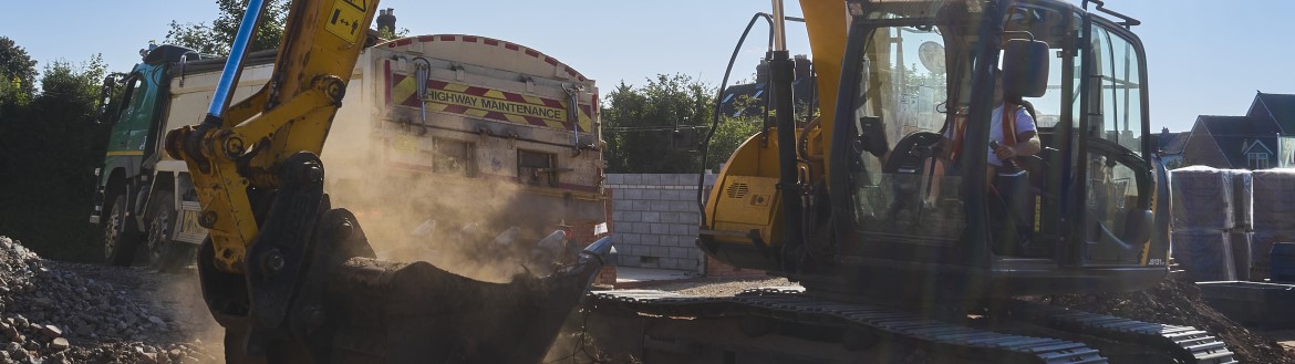 close view of construction vehicles with large shovel in front of image